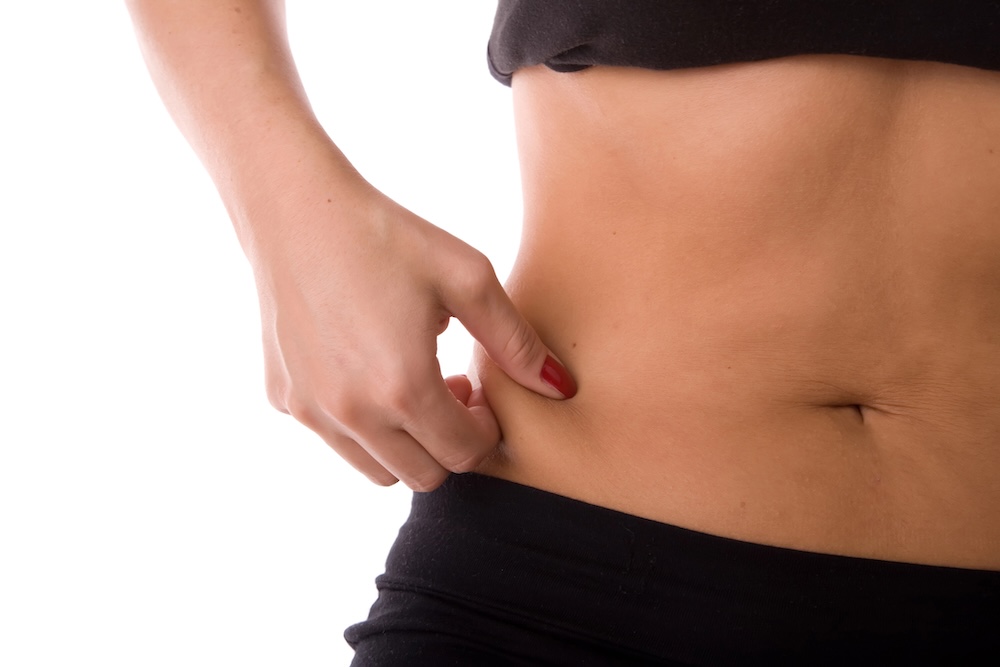 fingers pinching waistline